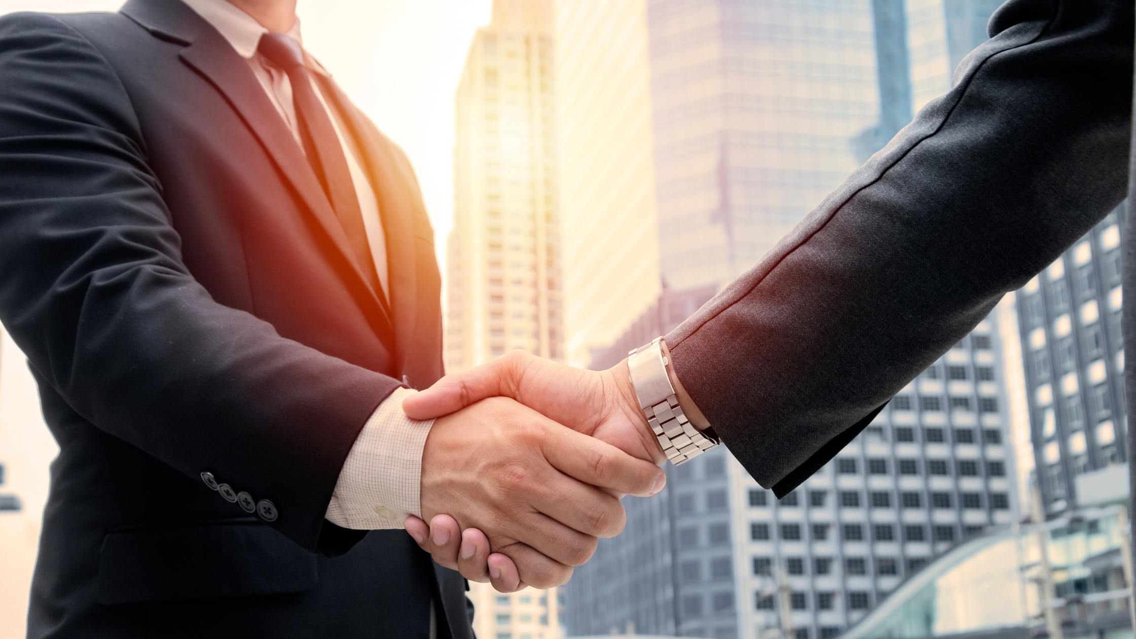 men shaking hands, How Business Brokers Maintain Confidentiality and Why It Matters